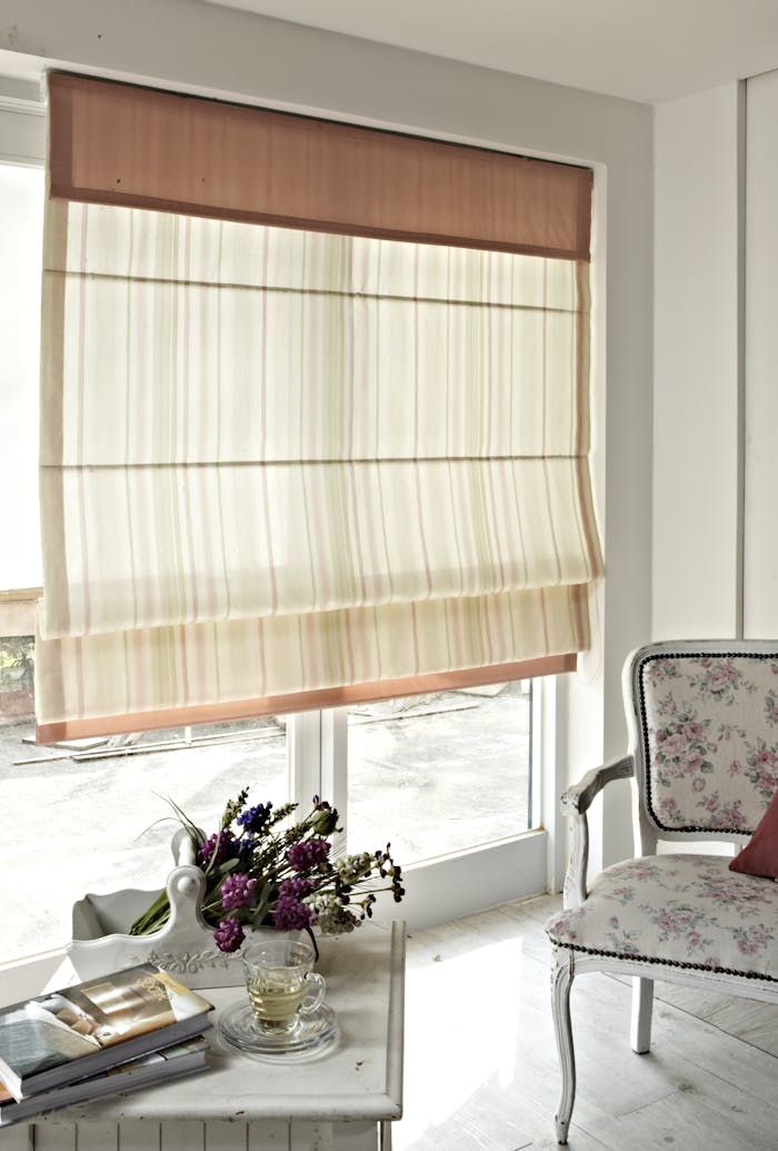 about-us-02 Bright, stylish interior featuring floral-patterned furniture and sophisticated decor.
